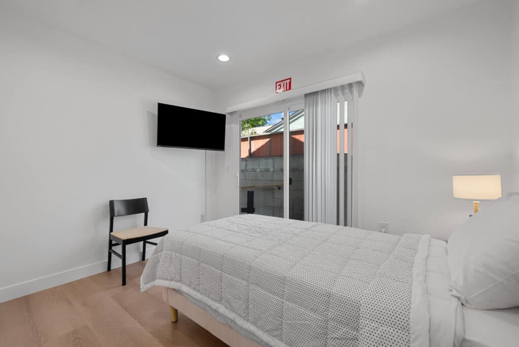 White Bedroom with big screen television